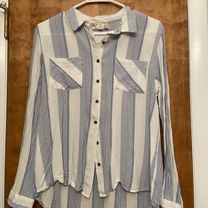 Striped button up shirt.